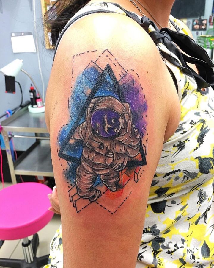 Astronaut with geometric triangle frame on an upper arm, by Sonia