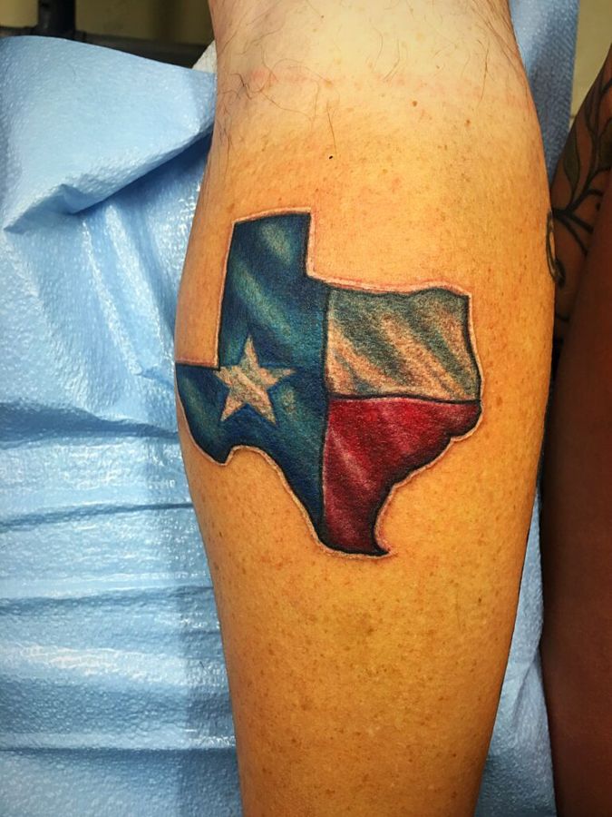 Texas flag in the shape of the state on an arm, by Sonia