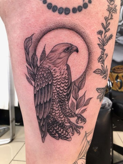 Blackwork bird with moon phases on an arm, by Momo