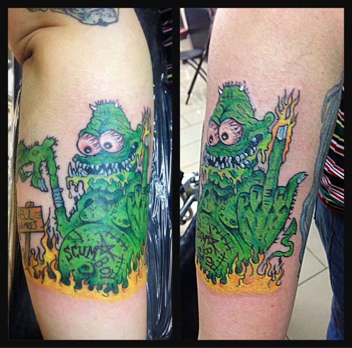Matching green kaiju calf tattoos by Sonia